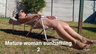 Mature woman sunbathing 2