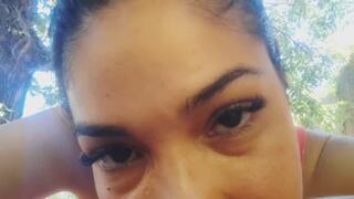 She blinks as she watches you.