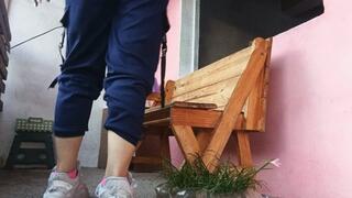 Woman smelling her socks and feet after arriving from training (7)
