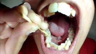 Cleaning plaque off my dirty teeth with a wooden toothpick after 15 days without brushing (close-up) With love for you
