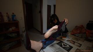 Beauty girl with heel high heel sandals on table, dirty soles shoes and barefeet.