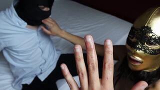 Biting and licking her fingers