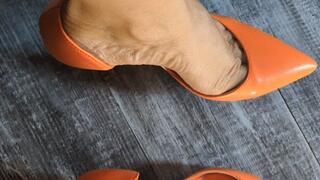 Katherine heel popping Goddess on orange Louboutin Heels