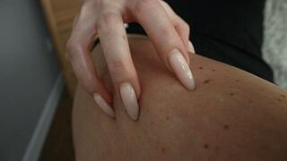 Long sharp nails scratching leg.