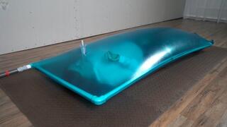 Blue inflatable latex vacuum bed for Sonya with a breathing dildo