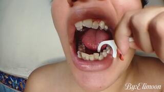 Using dental floss with clean teeth (close-up) after brushing teeth