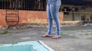 Woman desperate for chewing gum that sticks to her flip-flops while she tramples on them (3)