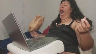 Yawning While Eating Popcorn in Bed – Tired Girl With Laptop