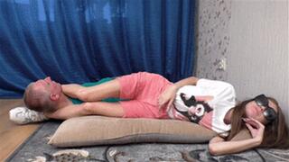 Teenage beauty lies on cushion keeping man's head between legs, vf2628x 1080p