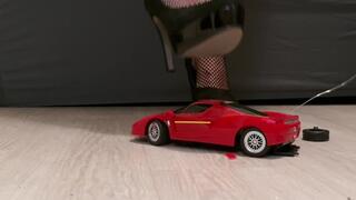 Toy Ferrari car VS high hells