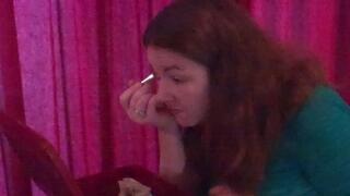 Putting on makeup to try and look less ugly