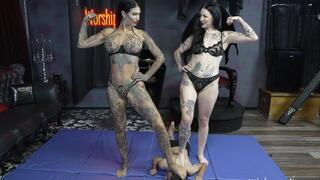 Two amazons wrestle a tiny man into submission