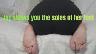 Jaz shows you the soles of her feet