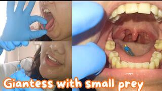 Giantess playing with her small prey