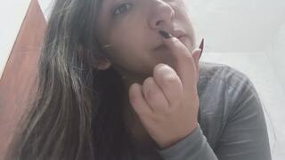 Lola picks at her nose with her long nails