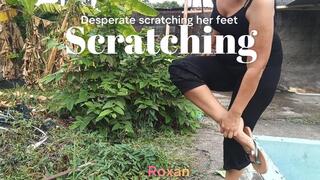Roxan scratching her feet because of strange itching (3)