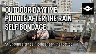 Femboy Struggling in the puddle after self-bondage on the rooftop after the rain