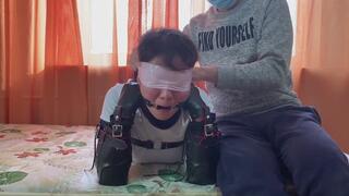 wn8-Put a gag in the woman's mouth, tape her limbs together, and then make her drool.