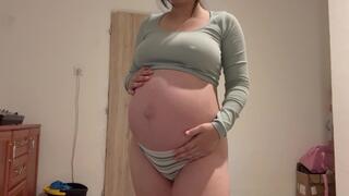 Pregnant Indian stepsister goes into the bathroom and shows off her big belly, then masturbates and plays with her pussy until she has an orgasm. She does a camel toe pussy and plays with her belly too.