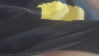 A hot woman smoking and showing off her big, juicy breasts.