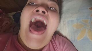 Open your mouth wide and show what's inside.