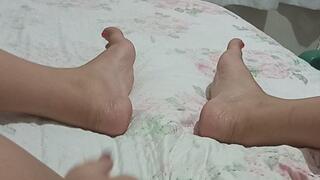 Beautiful brunette shows her pussy and feet.