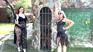 Slave getting punished merciless by two Dommes in the sun