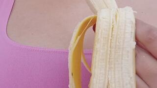 beautiful girl eating a banana