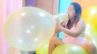 Sexy Juju Blows To Pop 2 Big Balloons While Riding A Huge Yellow Doll Balloon