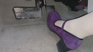Evalynn driving in purple heels