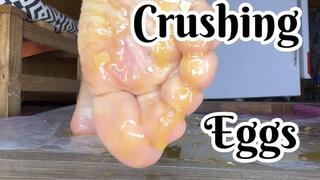 Crushing eggs with bare feet