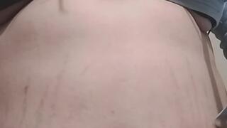 struggling to put the belt on my jeans