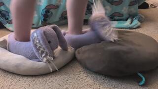Luna trampling on, crushing, and dancing on 2 plushies with her big purple bunny slippers. plushie stomp 1