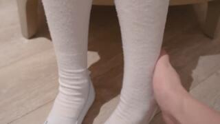 Girl in white socks and jeans
