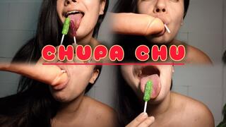 Sucking on a lollipop and a dildo at the same time