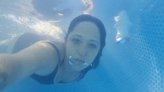 Underwater play, bubbles, rings, talking, swimming