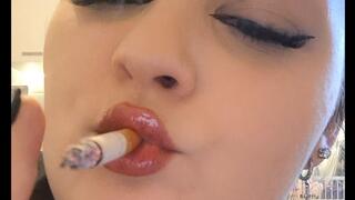 Slow chain smoking with glossy lips