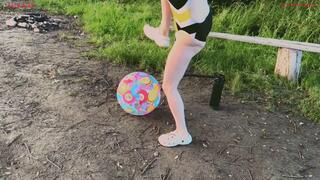 Alla burst a beach ball with her foot