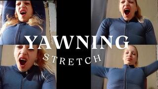 Yawning while I brush my hair