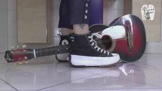 Guitar under Chucks Sneakers