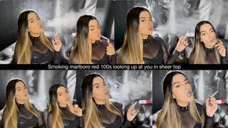 Smoking marlboro red 100s looking up at you in sheer top