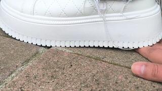 My neighbor trampling My hand ( sneakers)