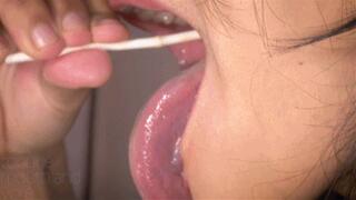 Beautiful Long, Wet Tongue and Moist Lips On A Lucky Lollipop