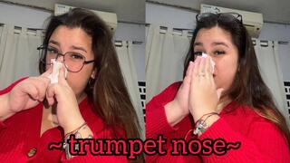 Blowing his nose like a trumpet + close-up