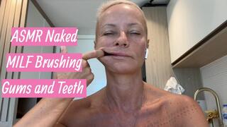 Naked MILF Brushing Gums and Teeth with Fingers in Bathroom