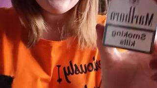 the smoking girlfills the balloons with smoke and pops them