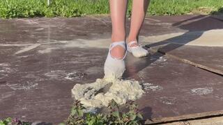 girl in dancing ballet flats is training, during training she steps on a sticky mass and dirties her ballet flats, but she cannot stop during training
