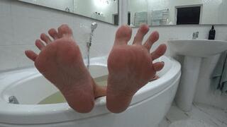 Damp and wrinkled feet after a bath a