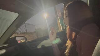 Artemisia Love smoking a cigarette in the car at night
