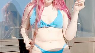 Smoking in a blue bikini